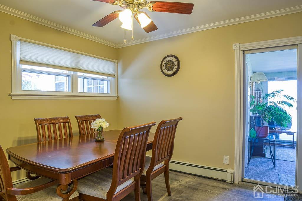 31 Windsor Road Edison, NJ 08817 - Photo 5 of 15 a view of a dining room with furniture and wooden floor