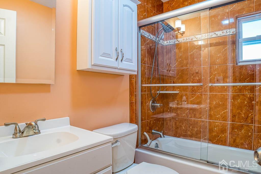 31 Windsor Road Edison, NJ 08817 - Photo 7 of 15 a bathroom with a sink a toilet and shower