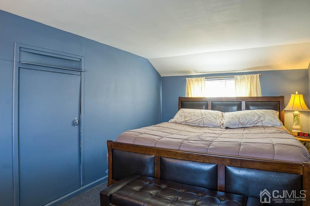31 Windsor Road Edison, NJ 08817 - Photo 10 of 15 a bedroom with a bed and wooden floor