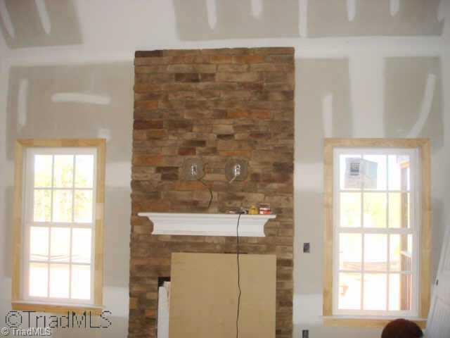 21 The Bluffs Rural Hall, NC 27045 - Photo 6 of 9 Other. The gorgeous tall stone fireplace is the centerpiece of the home. With the Master on the Main Level, 2 bedrooms upstairs along with 2 additional rooms, you ll have more space thatn you can use and room to grow!