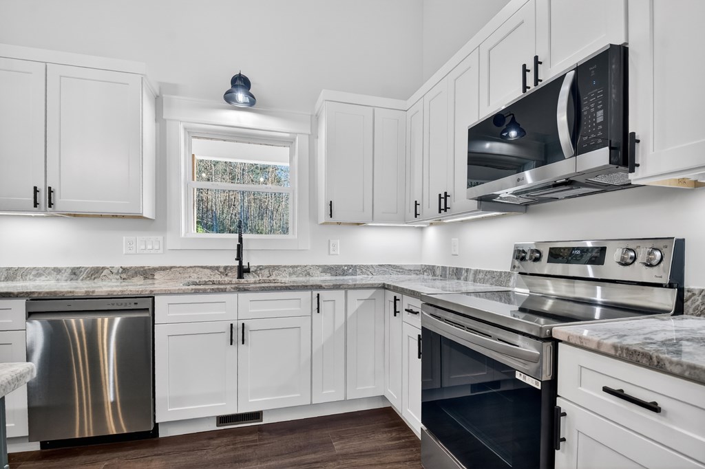 584 Brannon Nix Road Young Harris, GA 30582 - Photo 12 of 36 a kitchen with stainless steel appliances granite countertop a sink and a stove