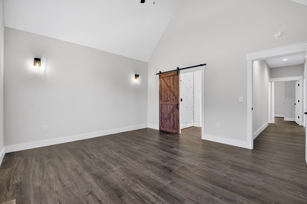 584 Brannon Nix Road Young Harris, GA 30582 - Photo 19 of 36 a view of an empty room with wooden floor and closet