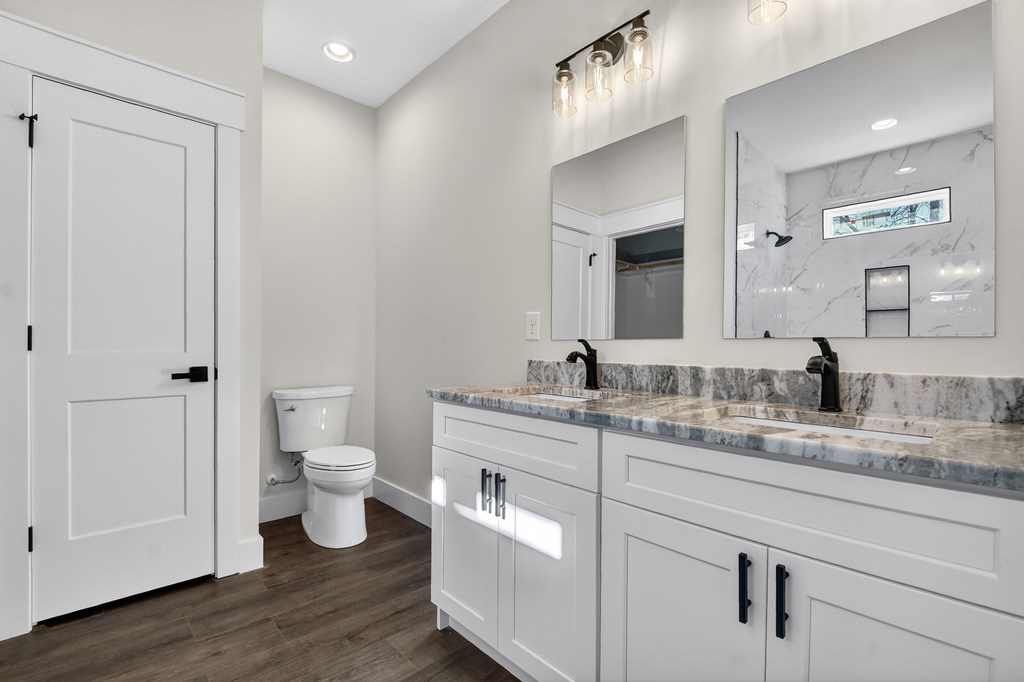 584 Brannon Nix Road Young Harris, GA 30582 - Photo 20 of 36 a spacious bathroom with a toilet a sink and mirror