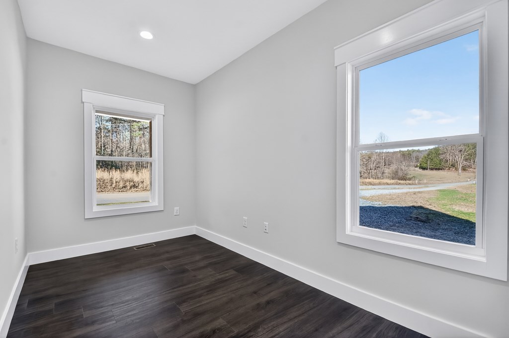 584 Brannon Nix Road Young Harris, GA 30582 - Photo 25 of 36 a view of an empty room with wooden floor and a window