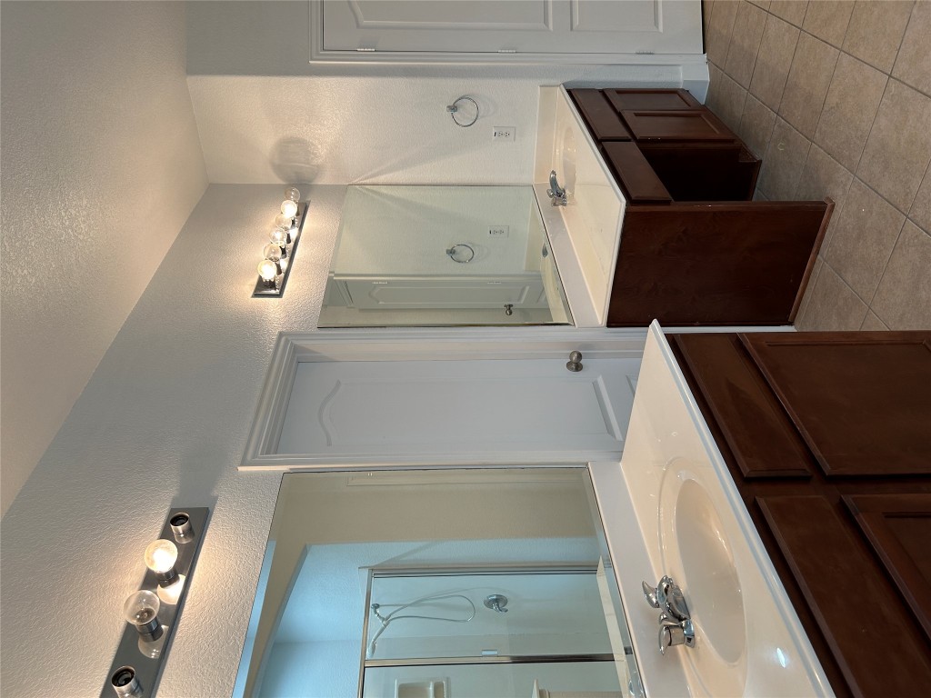 1374 Red Stag Place Round Rock, TX 78665 - Photo 11 of 15 a bathroom with a sink double vanity and a mirror