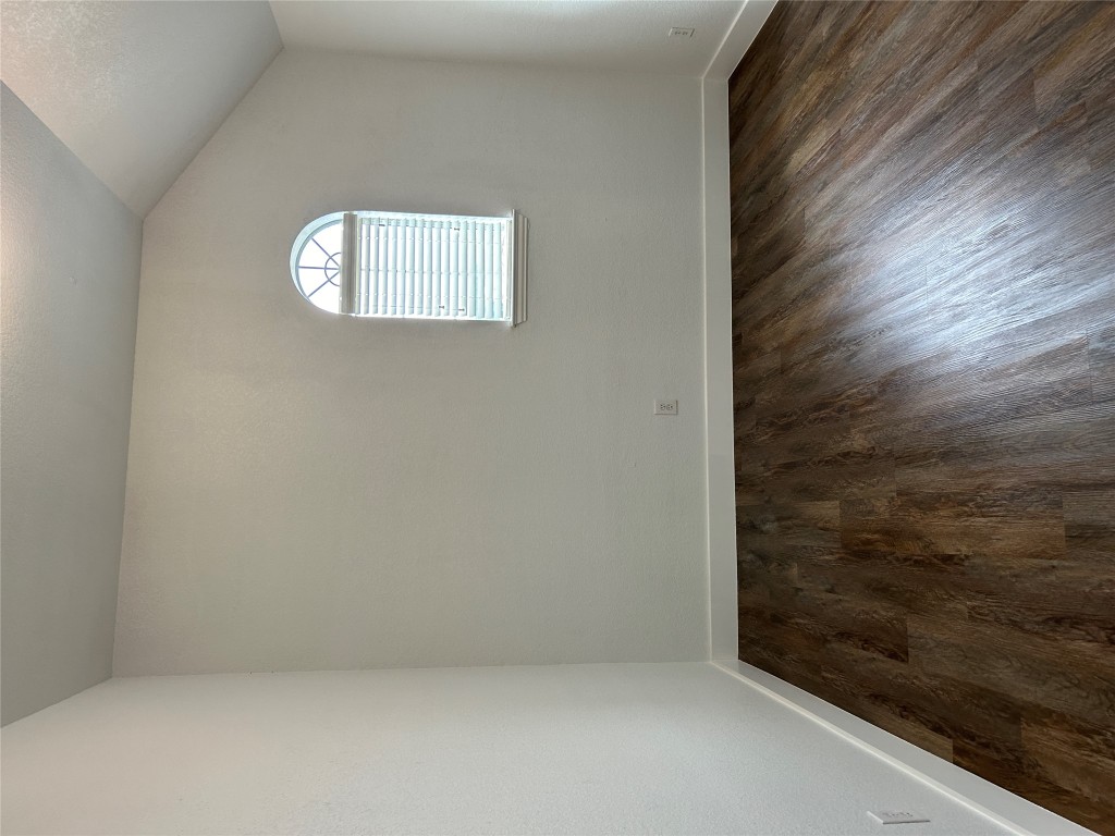 1374 Red Stag Place Round Rock, TX 78665 - Photo 13 of 15 an empty room with wooden floor and windows