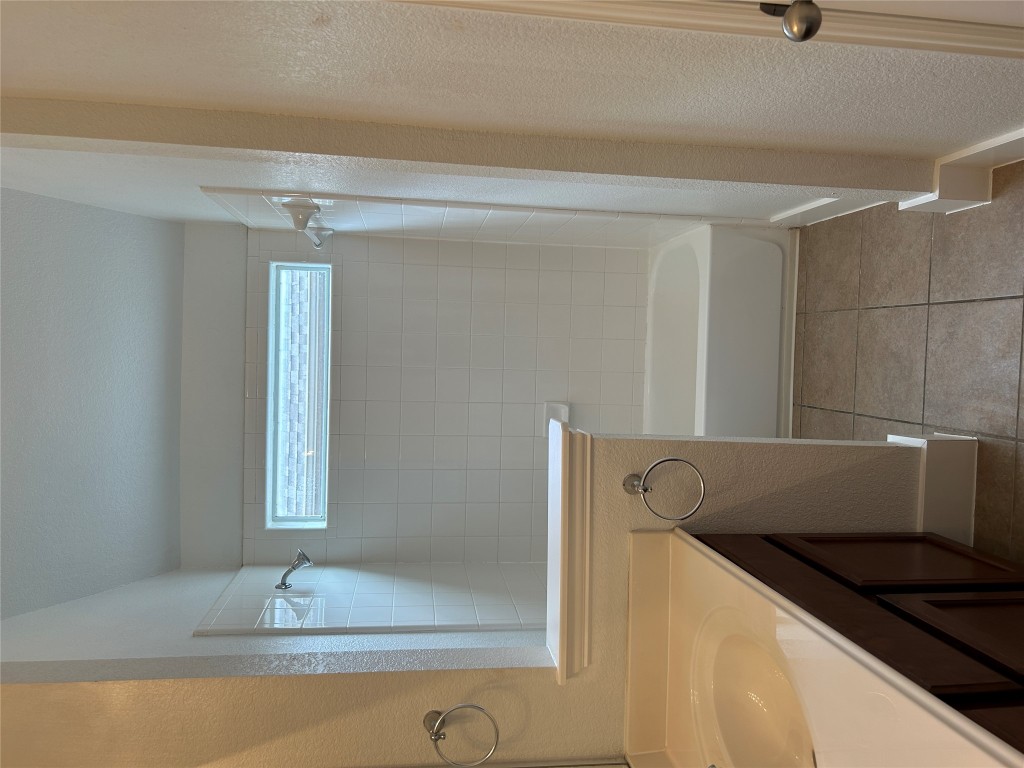 1374 Red Stag Place Round Rock, TX 78665 - Photo 15 of 15 a bathroom with a bathtub and a shower