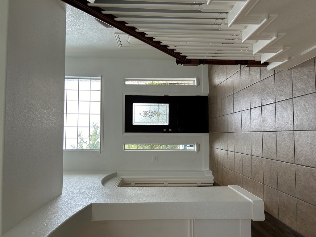 1374 Red Stag Place Round Rock, TX 78665 - Photo 3 of 15 a view of a hallway with entryway windows and stairs