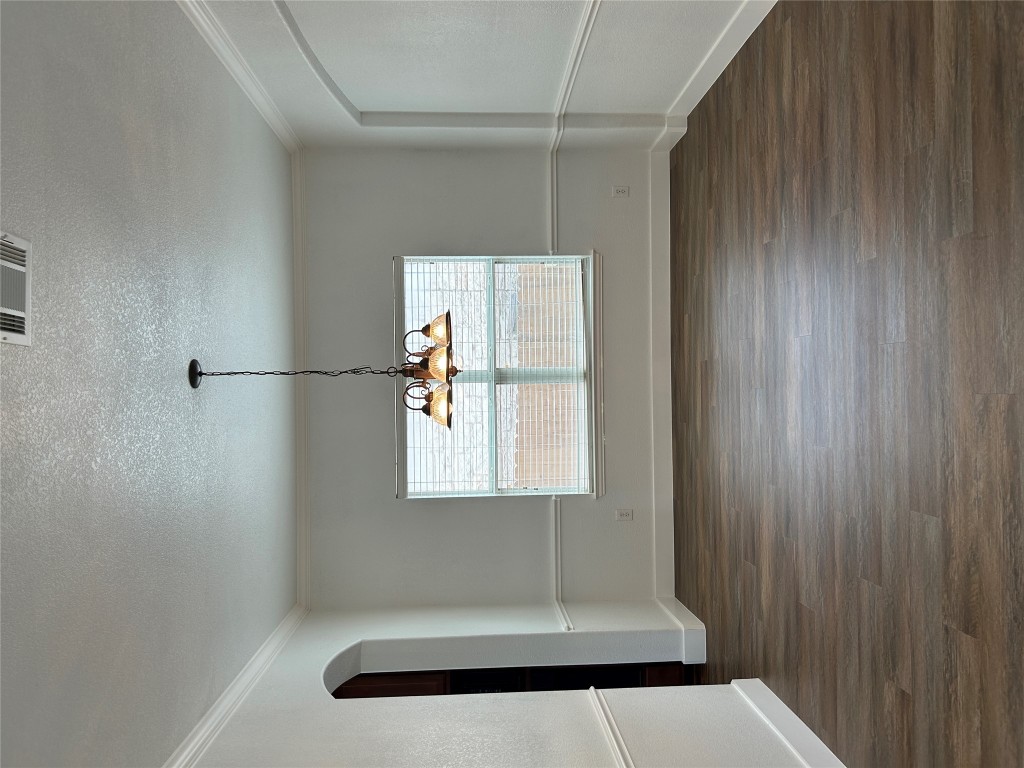 1374 Red Stag Place Round Rock, TX 78665 - Photo 7 of 15 a view of a room with wooden floor and a window