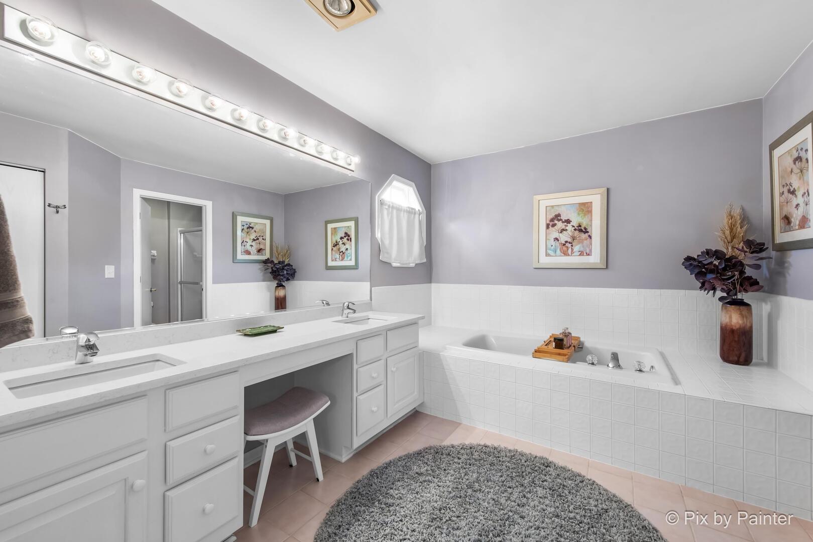 519 Shagbark Drive Elgin, IL 60123 - Photo 21 of 38 a spacious bathroom with a tub sink and mirror