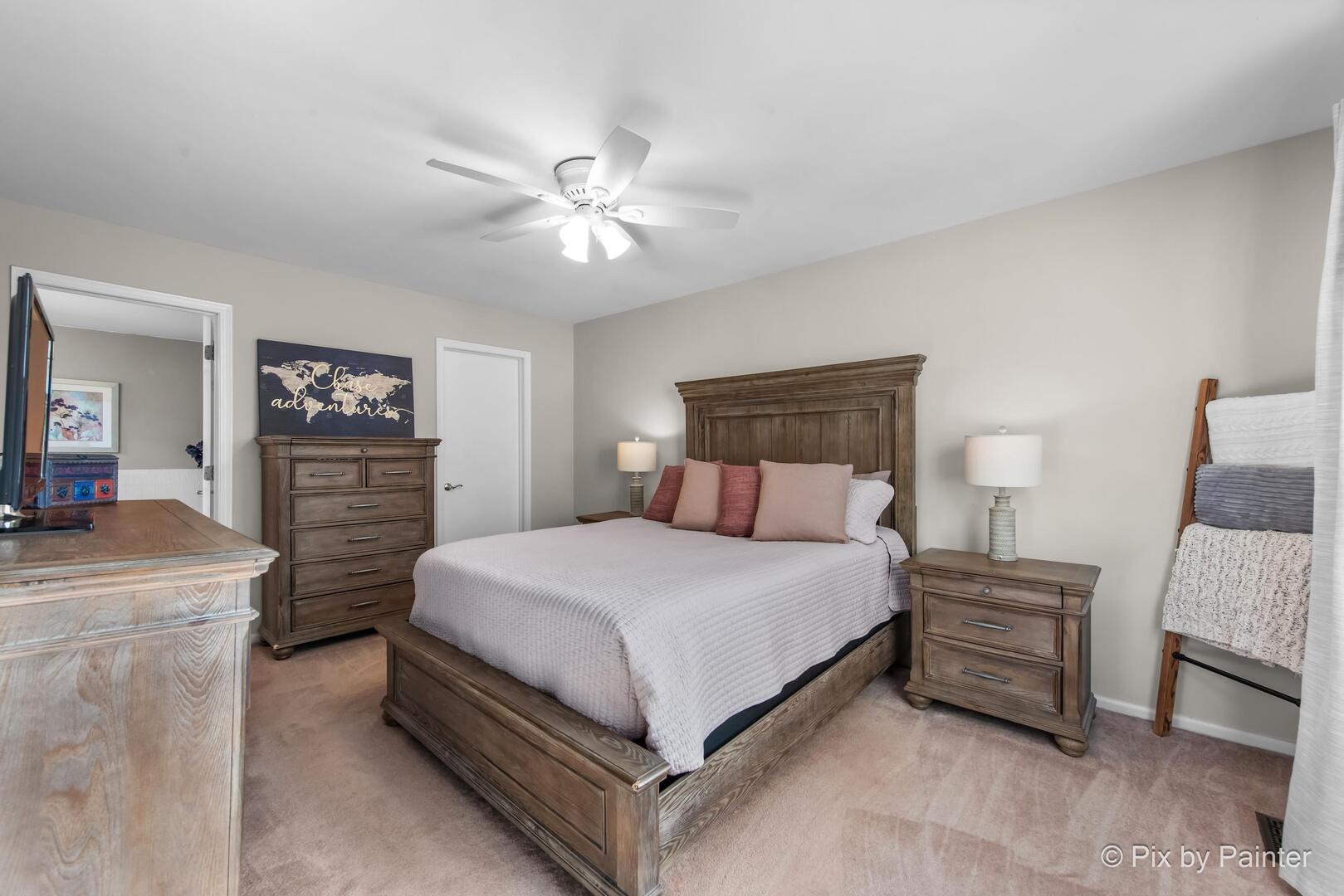 519 Shagbark Drive Elgin, IL 60123 - Photo 22 of 38 a bedroom with a bed and a chandelier