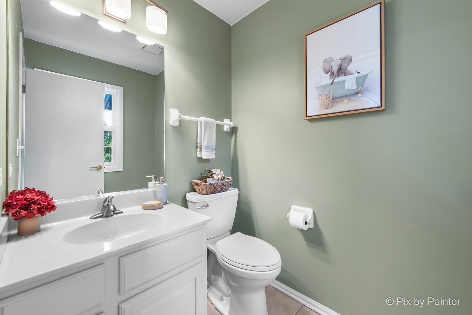 519 Shagbark Drive Elgin, IL 60123 - Photo 24 of 38 a bathroom with a sink mirror and toilet