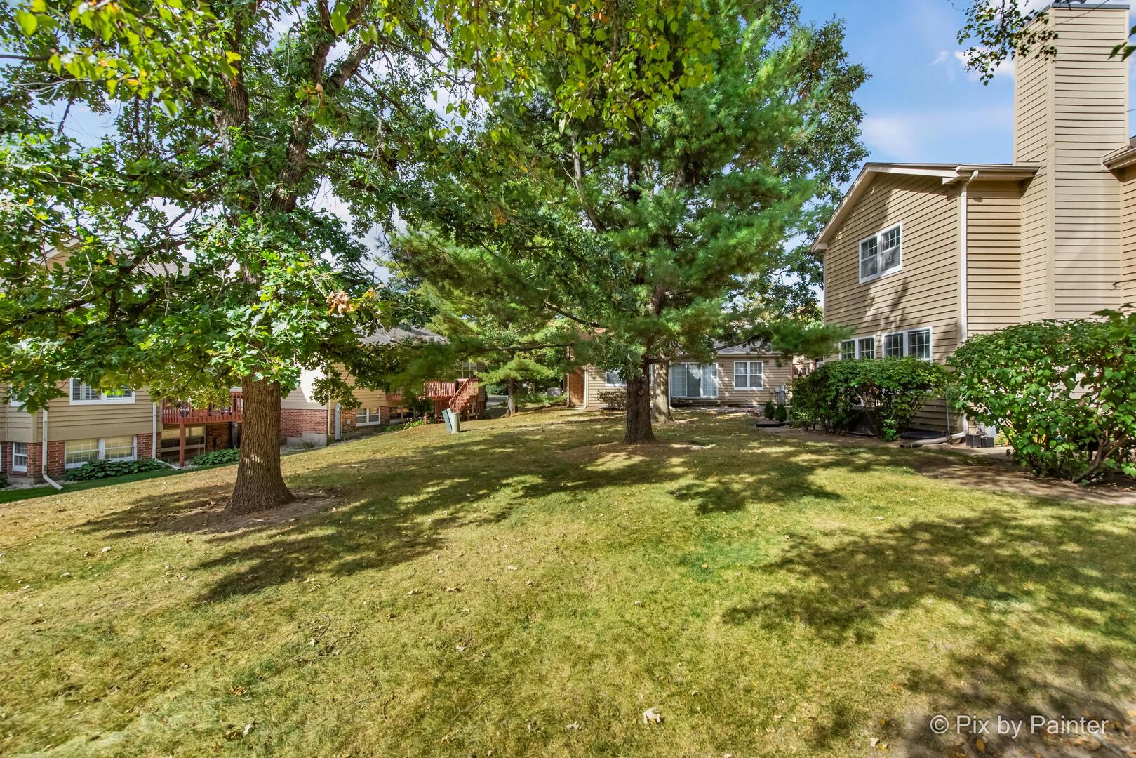 519 Shagbark Drive Elgin, IL 60123 - Photo 33 of 38 a view of a yard with plants and trees
