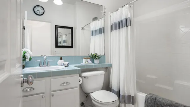 a bedroom with bed and a window