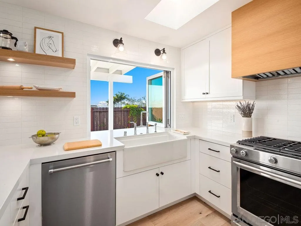 1710 Legaye Drive Cardiff, CA 92007 - Photo 13 of 43 a kitchen with a sink and a stove top oven