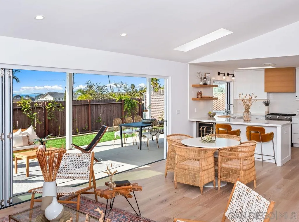 1710 Legaye Drive Cardiff, CA 92007 - Photo 17 of 43 a living room with furniture and a floor to ceiling window
