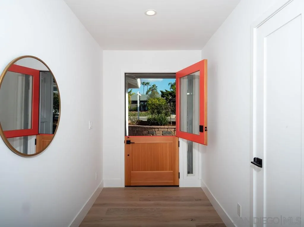 1710 Legaye Drive Cardiff, CA 92007 - Photo 20 of 43 a view of a room with wooden floor and a window