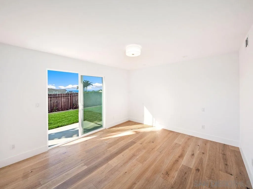 1710 Legaye Drive Cardiff, CA 92007 - Photo 26 of 43 a view of an empty room with wooden floor
