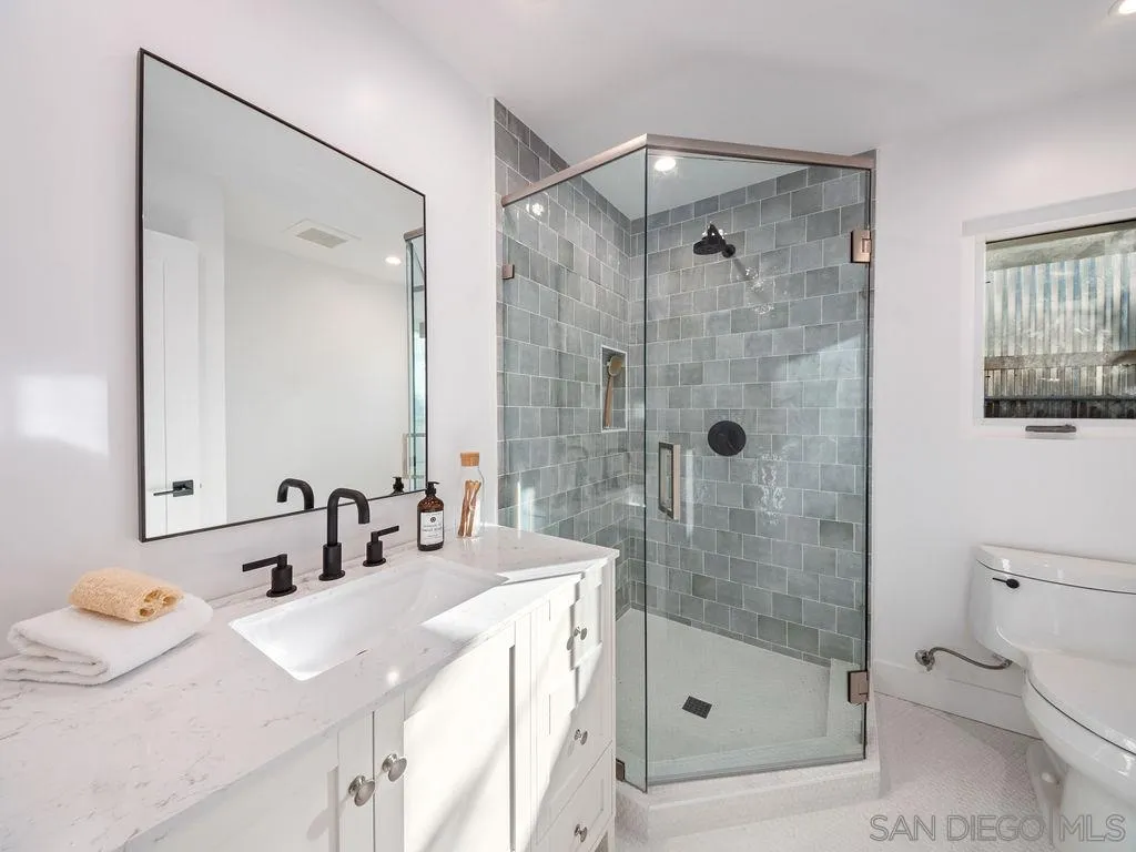 1710 Legaye Drive Cardiff, CA 92007 - Photo 35 of 43 a bathroom with a sink a toilet and shower