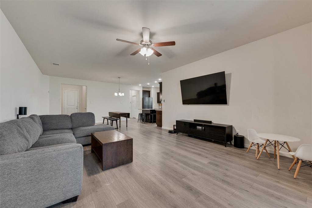 624 Hazeltine Road Red Oak, TX 75154 - Photo 20 of 37 a living room with furniture and a flat screen tv