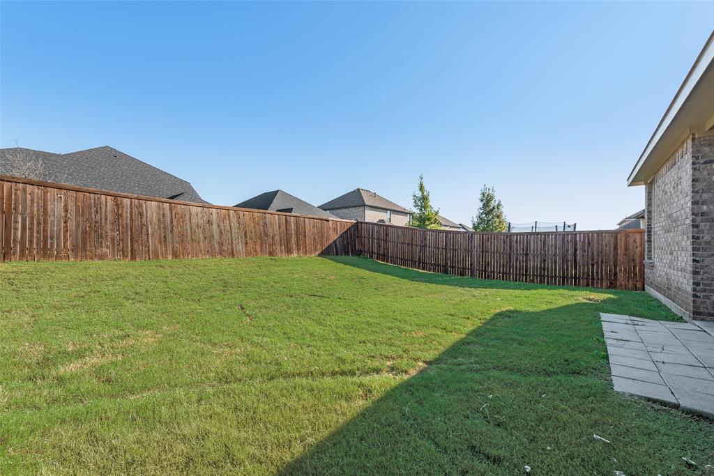 624 Hazeltine Road Red Oak, TX 75154 - Photo 35 of 37 a view of a backyard with wooden fence