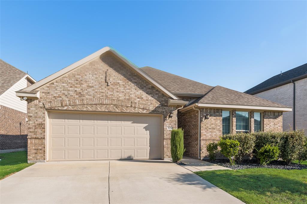 624 Hazeltine Road Red Oak, TX 75154 - Photo 6 of 37 a front view of a house with garden