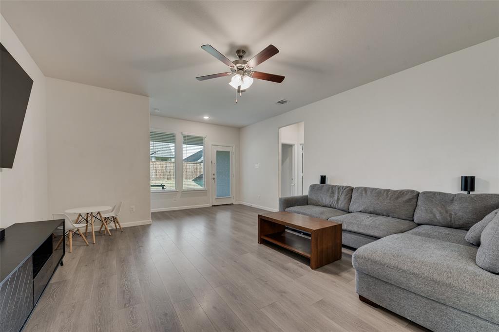 624 Hazeltine Road Red Oak, TX 75154 - Photo 9 of 37 a living room with furniture and wooden floor