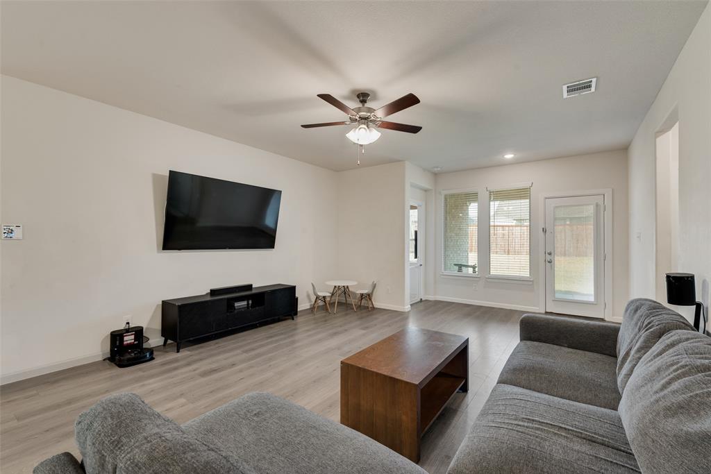 624 Hazeltine Road Red Oak, TX 75154 - Photo 10 of 37 a living room with furniture and a flat screen tv