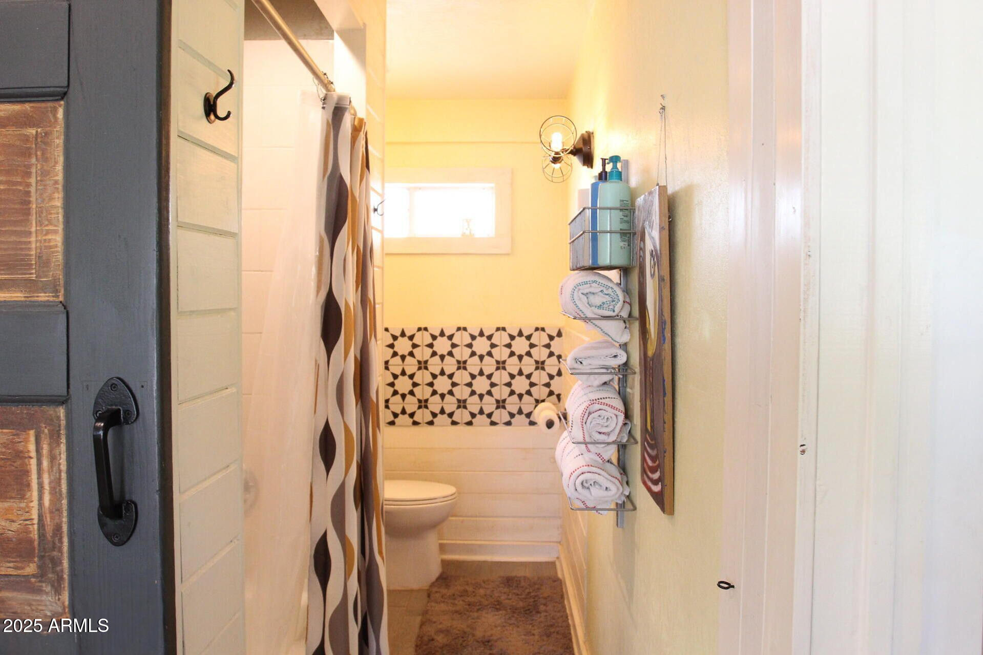 1 Arizona Street Bisbee, AZ 85603 - Photo 13 of 38 a bathroom with a toilet and shower