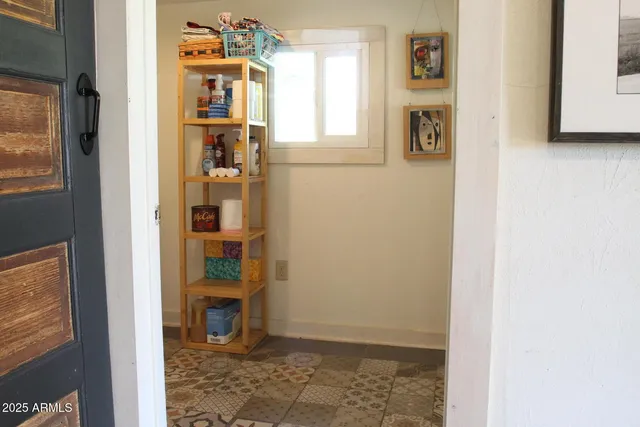 a view of an entryway with wooden floor