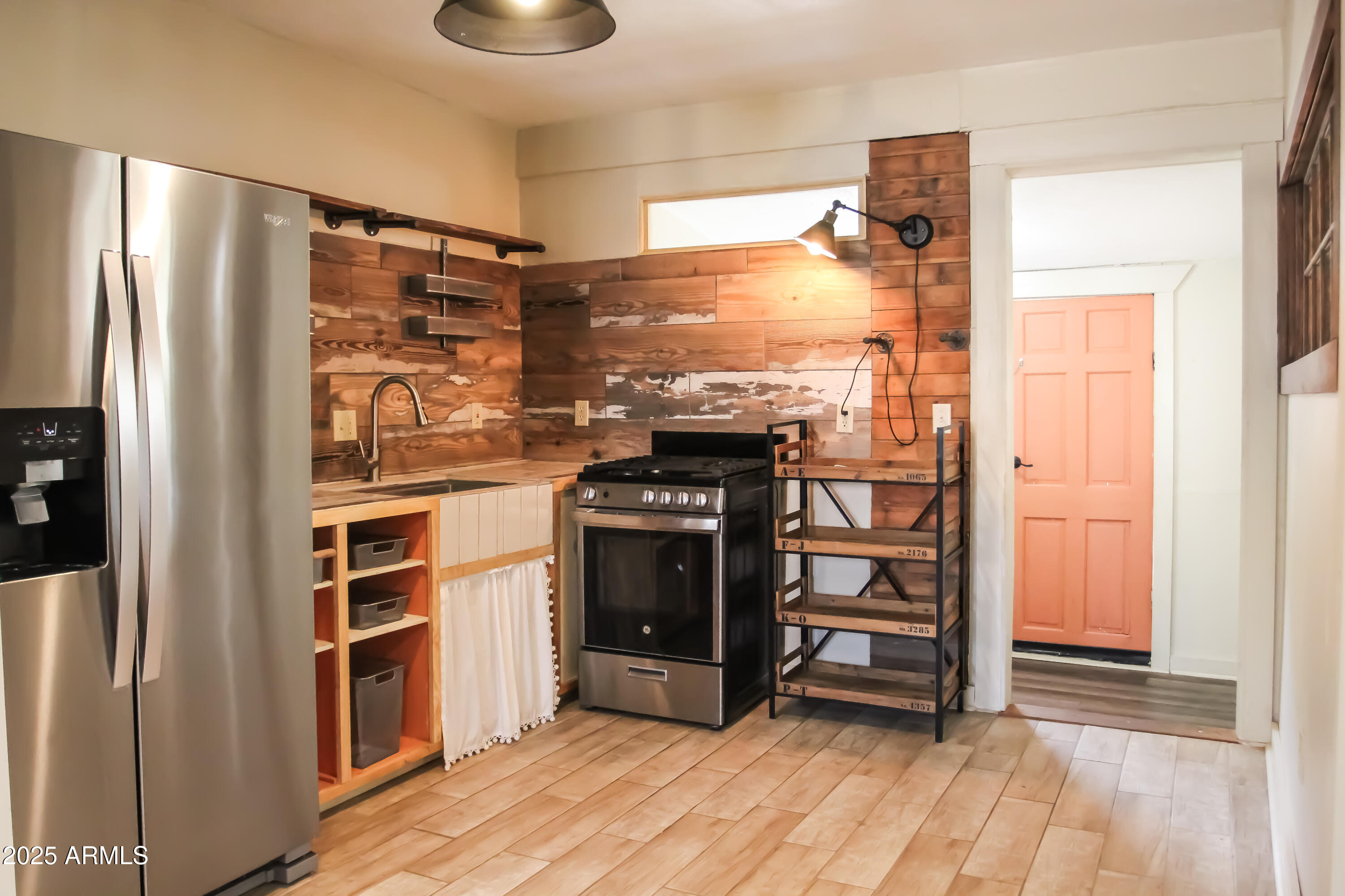 1 Arizona Street Bisbee, AZ 85603 - Photo 20 of 38 a kitchen with stainless steel appliances a stove and a refrigerator
