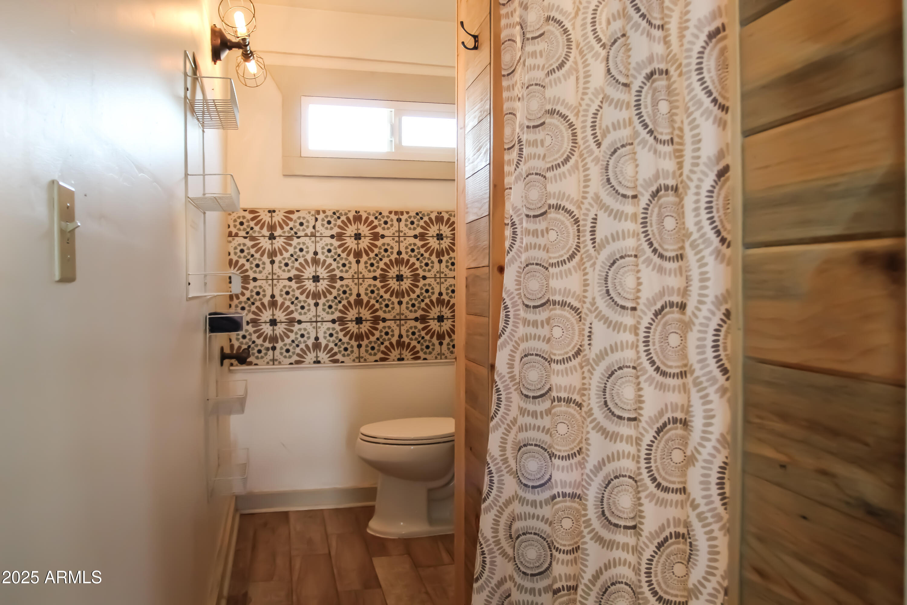 1 Arizona Street Bisbee, AZ 85603 - Photo 22 of 38 a bathroom with a toilet and shower curtain