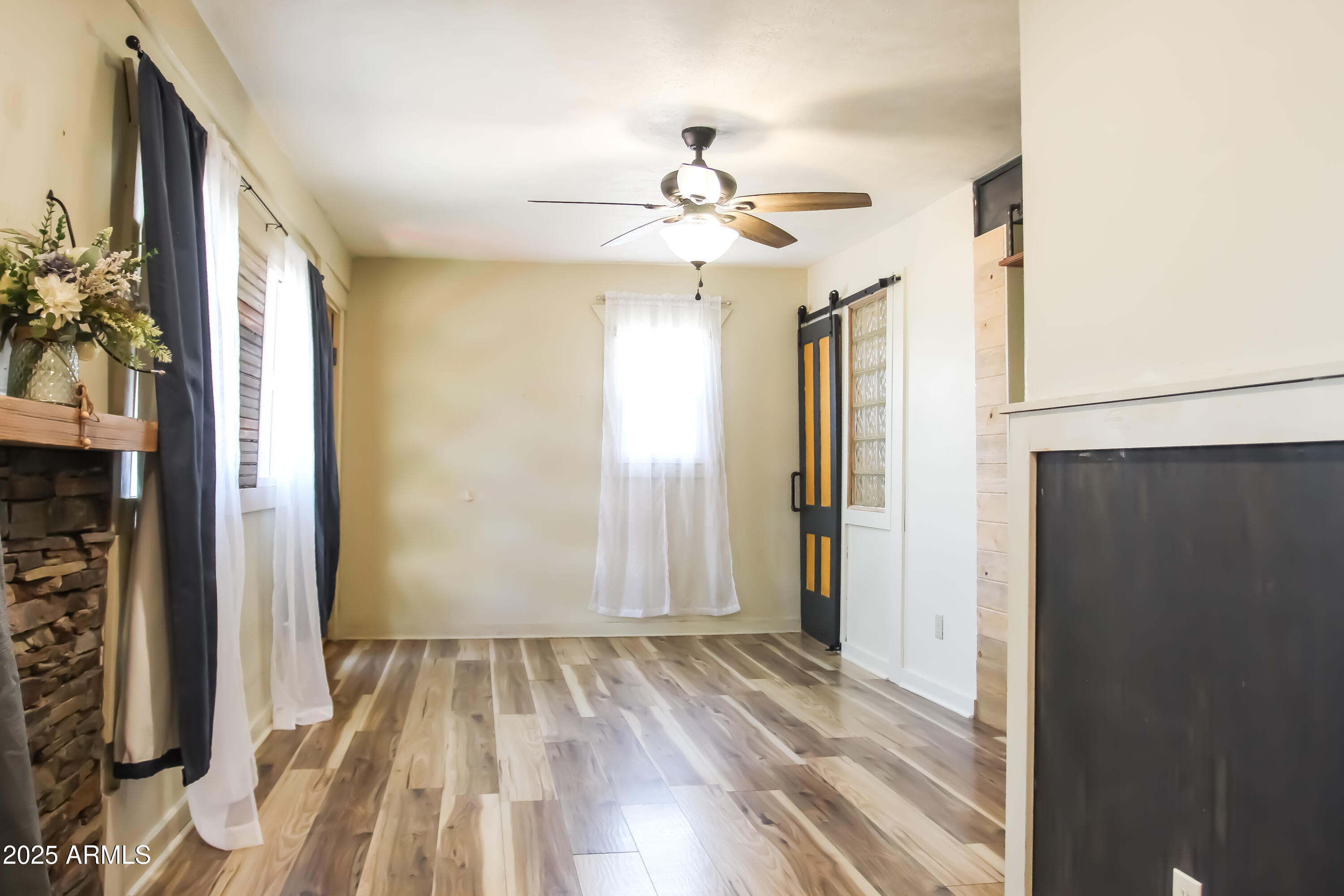 1 Arizona Street Bisbee, AZ 85603 - Photo 23 of 38 wooden floor in an empty room with a mirror