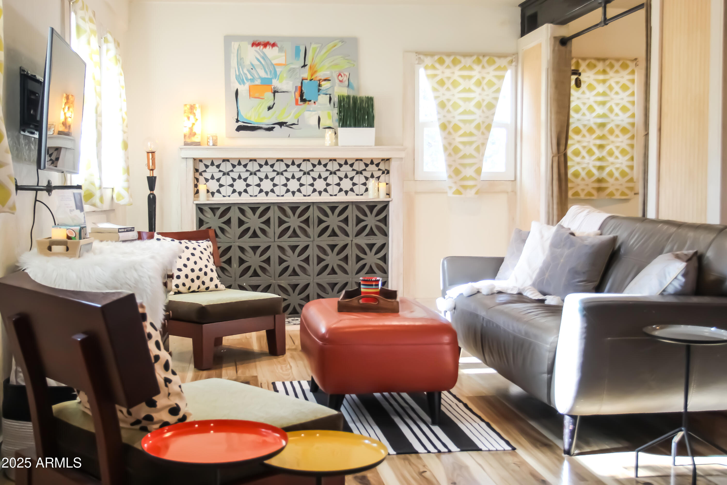 1 Arizona Street Bisbee, AZ 85603 - Photo 3 of 38 a living room with furniture a fireplace and a large window
