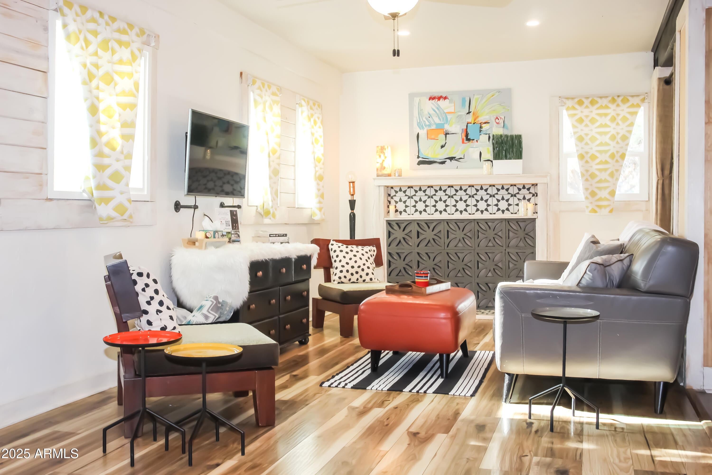 1 Arizona Street Bisbee, AZ 85603 - Photo 4 of 38 a living room with furniture a fireplace and a large window