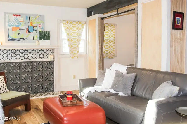 a living room with furniture and a window