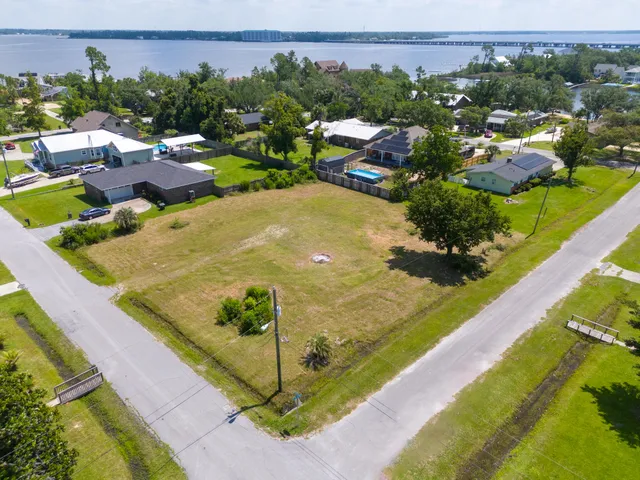 a view of a swimming pool with a yard