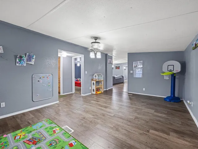 a view of an entryway with wooden floor