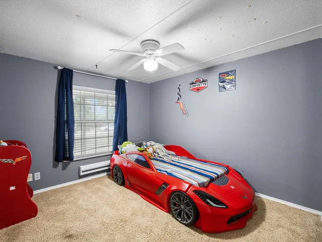 a room with a bed and a chandelier