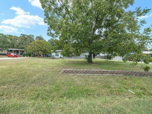 a view of a backyard of the house