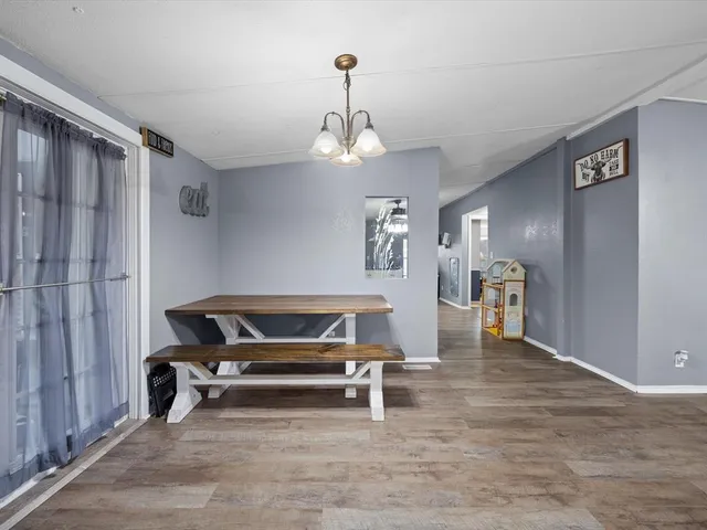 a bedroom with furniture and a chandelier