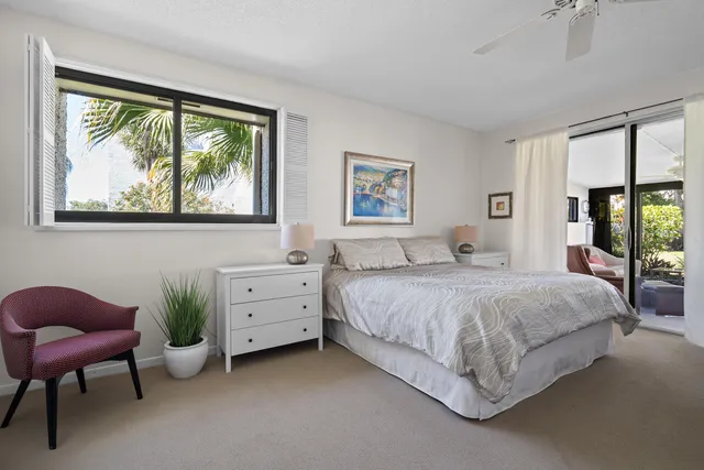 a spacious bedroom with a bed and a couch