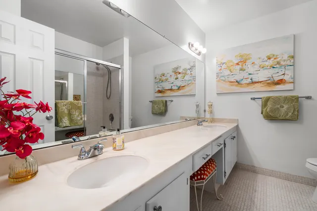 a bathroom with a sink a vanity and a mirror