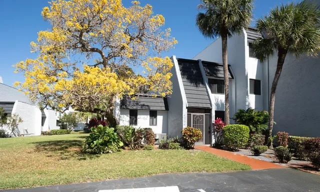 a view of a house with a garden