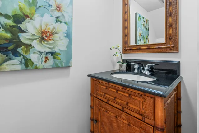 a bathroom with a sink a vanity and a mirror