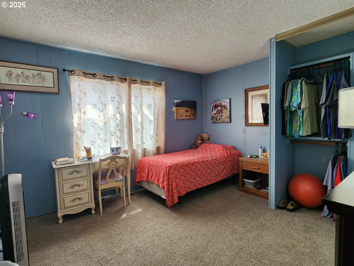 430 Birch Street Drain, OR 97435 - Photo 19 of 33 a bed room with a bed and a window