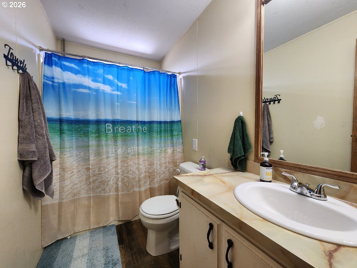 430 Birch Street Drain, OR 97435 - Photo 23 of 33 a bathroom with a sink a toilet and shower