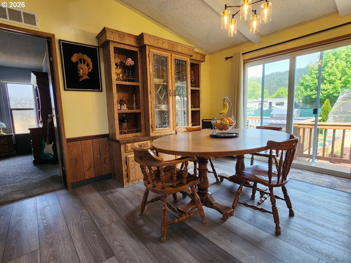 430 Birch Street Drain, OR 97435 - Photo 8 of 33 a view of a dining room with furniture window and wooden floor