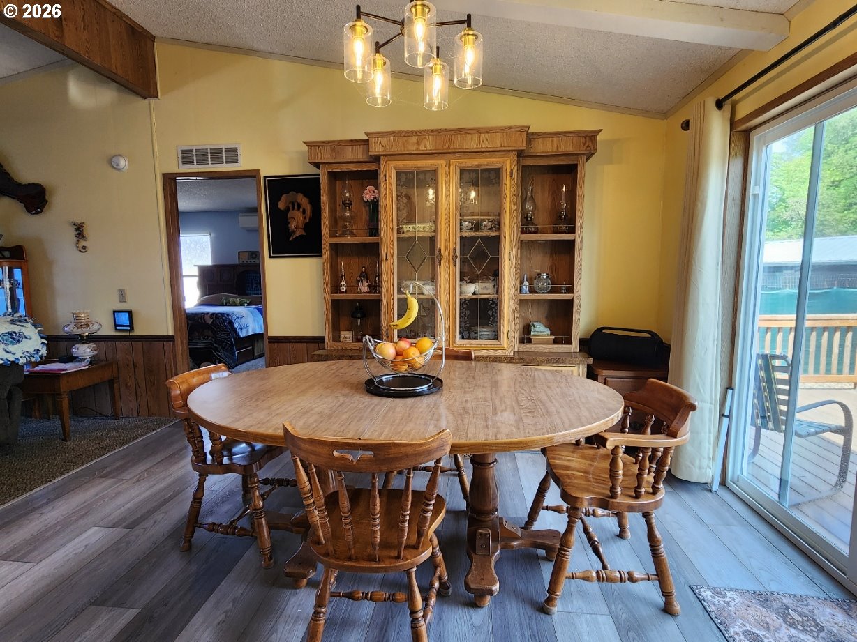 430 Birch Street Drain, OR 97435 - Photo 9 of 33 a view of a dining room with furniture and wooden floor