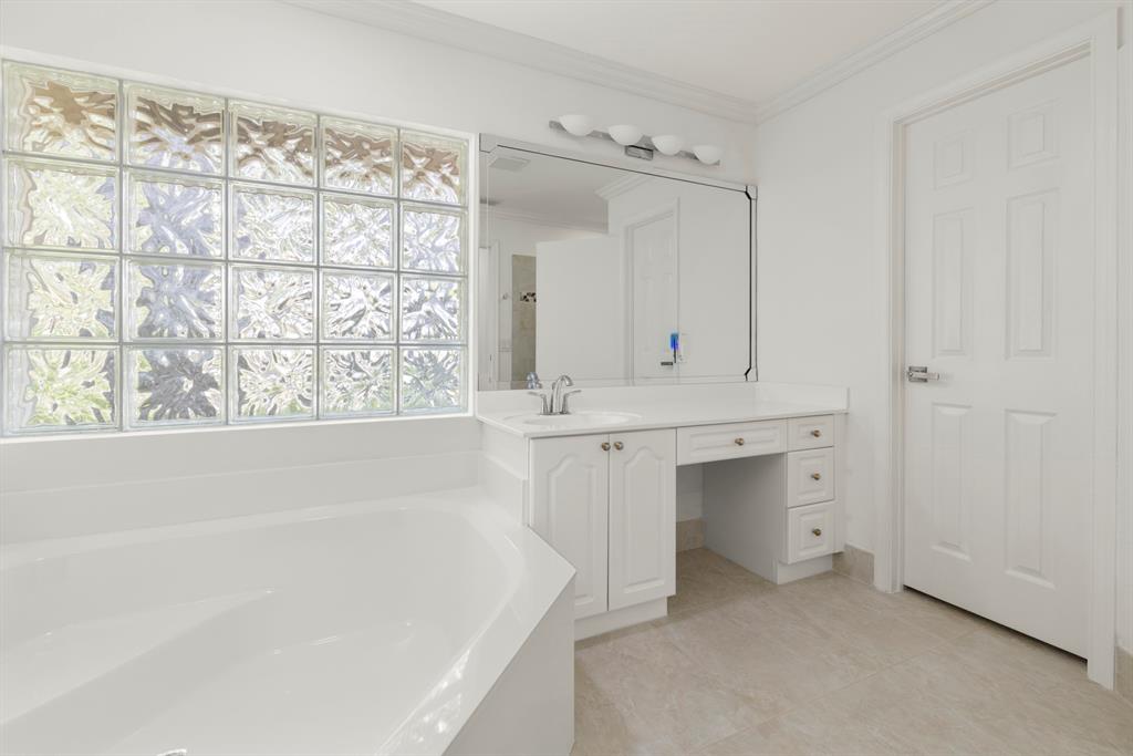 3707 Oak Ridge Circle Weston, FL 33331 - Photo 18 of 47 a bathroom with a sink and a bathtub